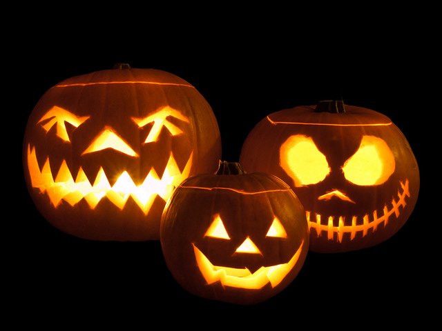 Jack-o'-lanterns carved from pumpkins and lit with tea lights